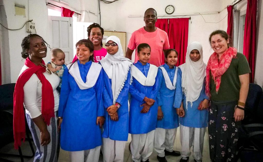 Mercer On Mission participants are pictured with a group of girls at Ahmadi School after a music class.