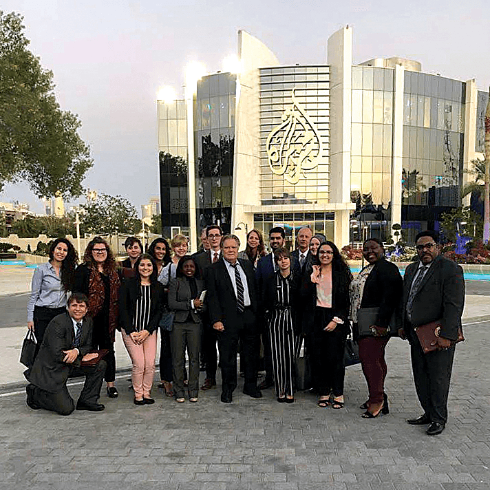 The fellows are pictured in front of the Al Jazeera headquarters, one of the many sites they visiting in Qatar during their trip.