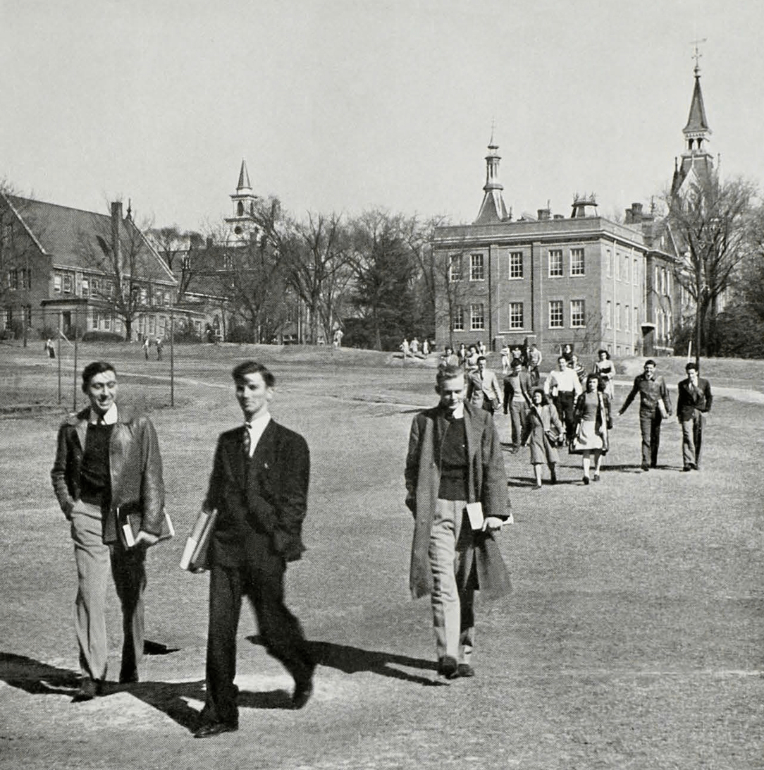 This picture in the 1943 Cauldron shows William Brown, third from left, and other Mercer students walking on campus.