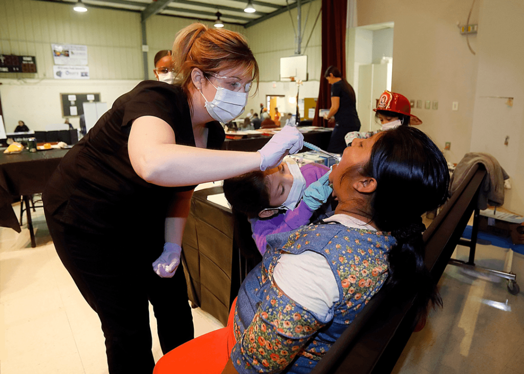 A woman received a dental check during the Hispanic Health Fair in February. 