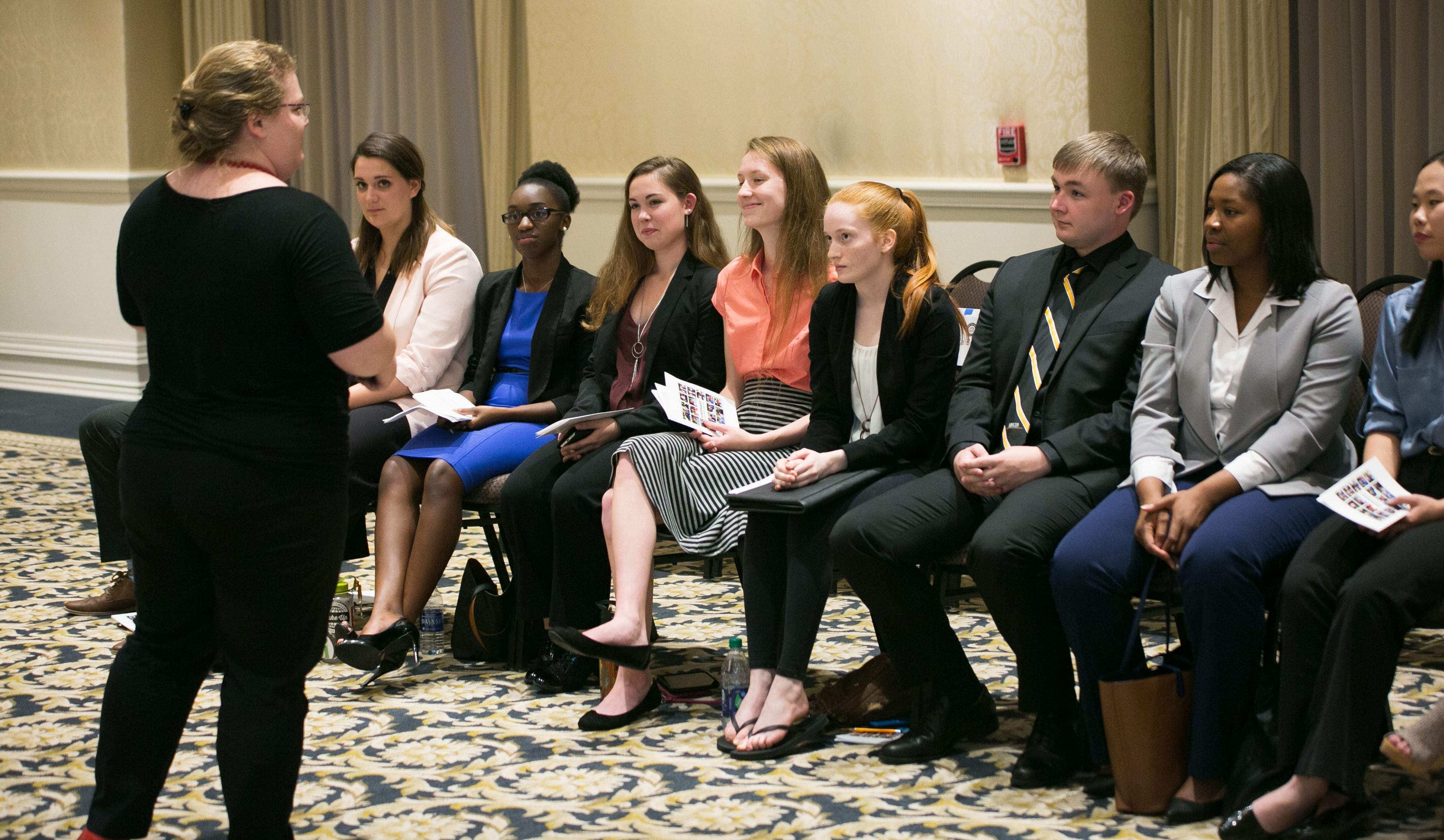 Mercer Quality Enhancement Plan Associate Director Hannah Vann Nabi talks with students presenting at the 2018 Visionary Student Panel event.